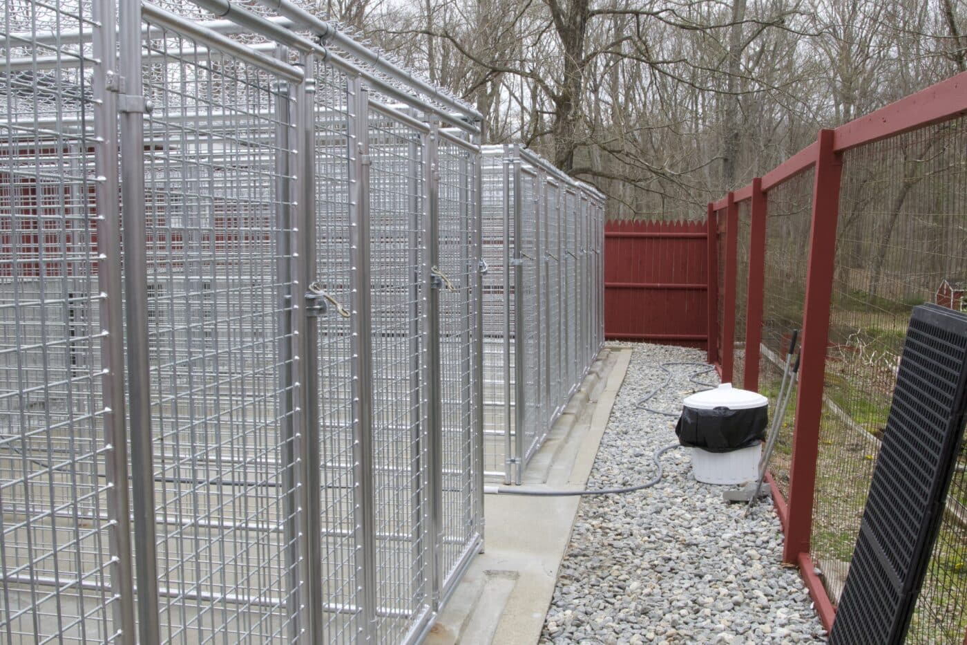 outdoor kennels inside red fence